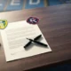 New England Revolution and Leeds United crests beside a blank transfer contract and pen.